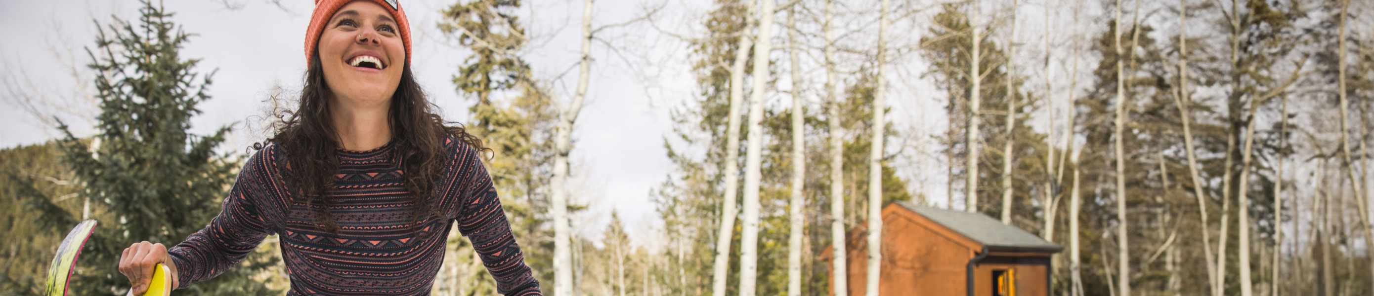 Snowboarder wearing women's Smartwool base layer top