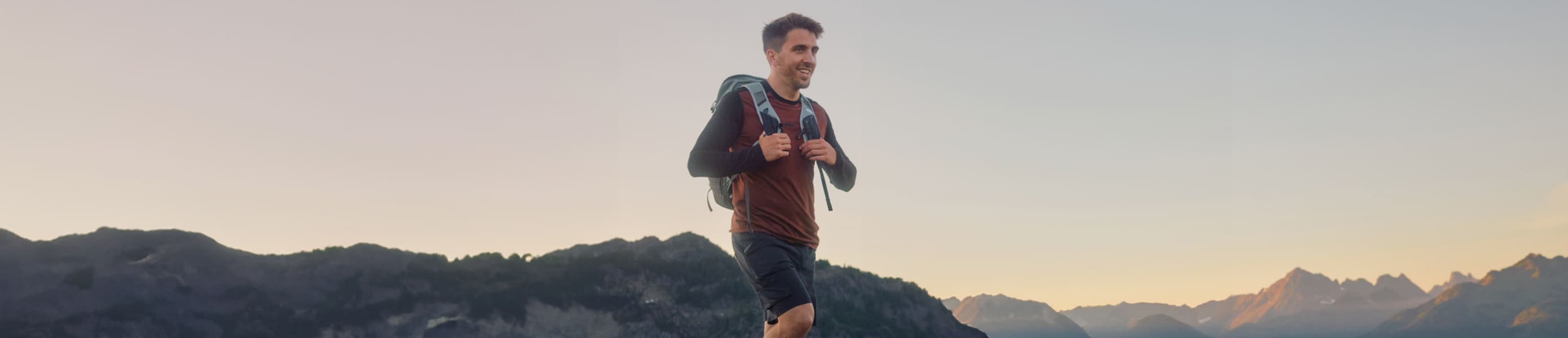 Man wearing Smartwool baselayer top about to go ski