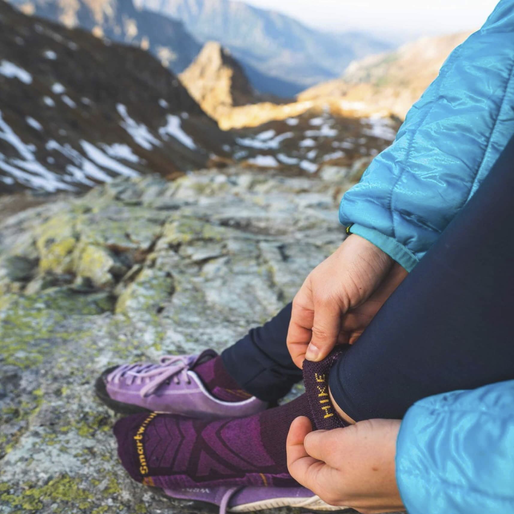 a person wearing Smartwool Hiking Socks on top of a mountain