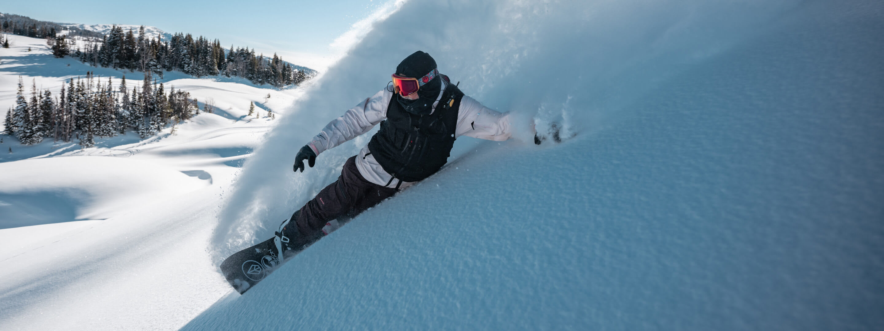 Person snowboarding down a hill 