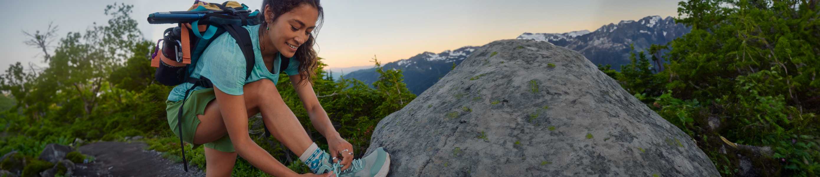 Two women hiking in Smartwool jackets and hats