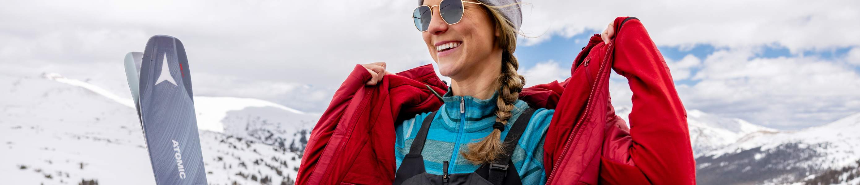 Woman wearing a Smartwool jacket outside