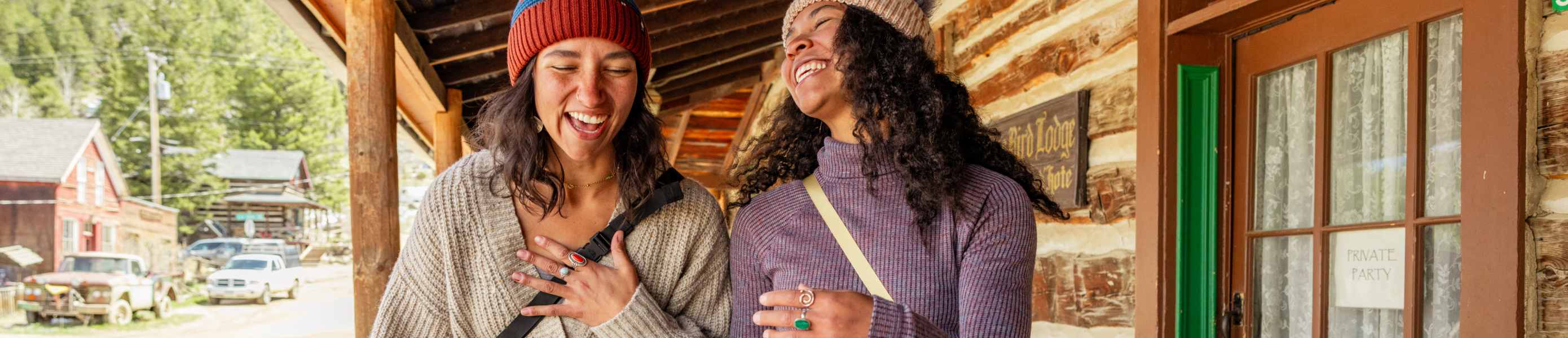 Smartwool sweaters worn by two women in mountains